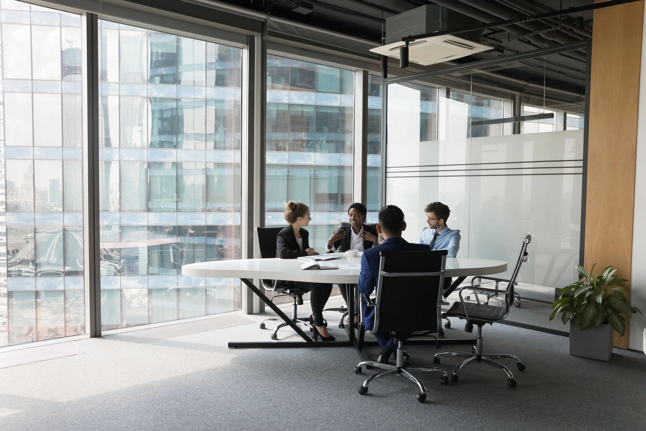 Business technology team collaborating in a meeting room