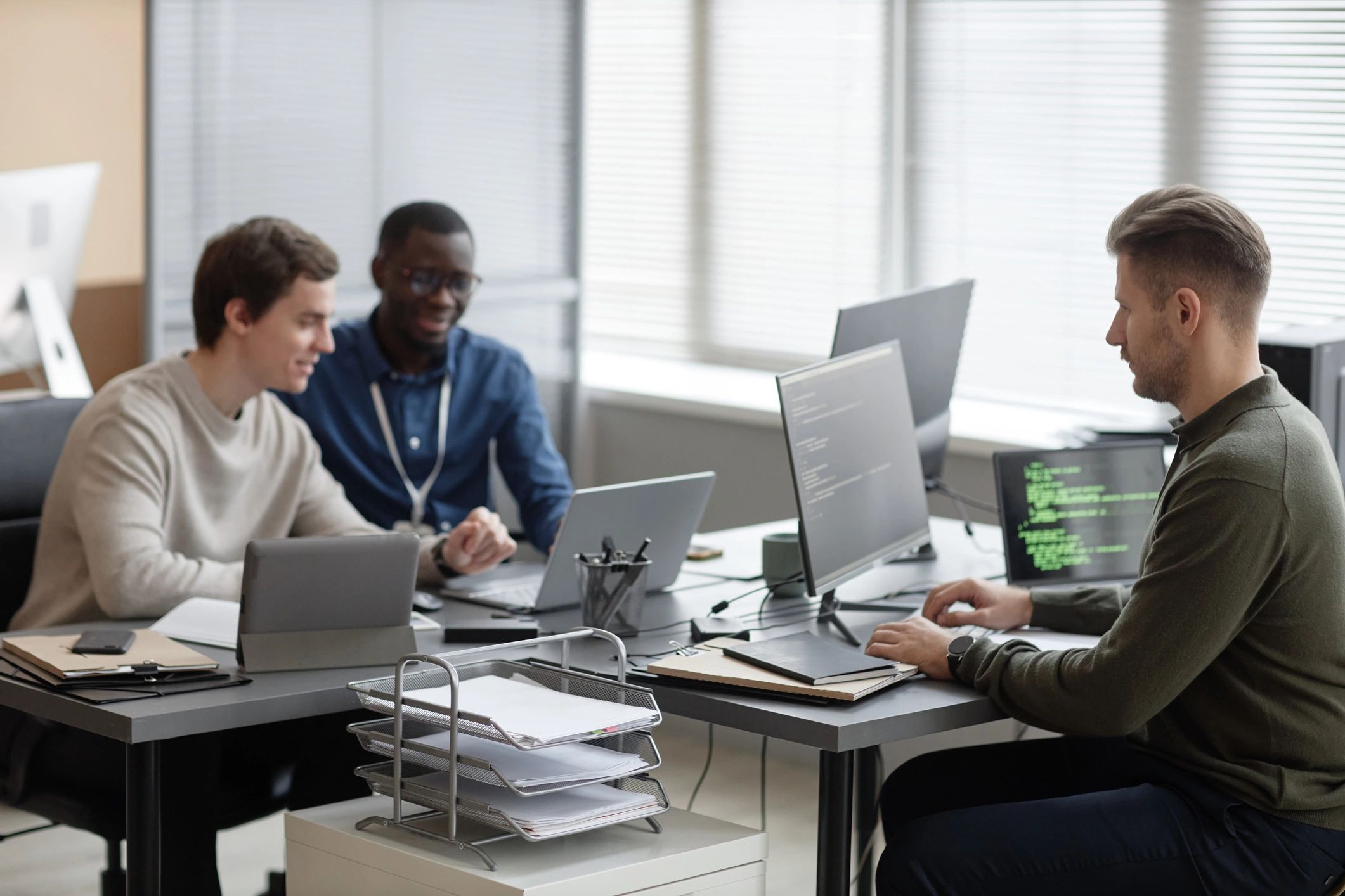 IT team collaborating in a modern office